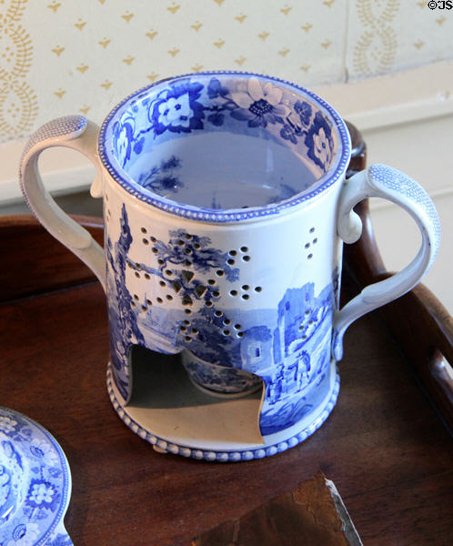 Ceramic blue jar to warm contents over small flame in bedchamber at Georgian House museum. Edinburgh, Scotland.