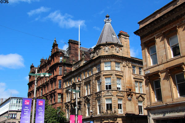 Renaissance-style commercial sandstone building with octagonal corner (1897-8) (Buchanan St. at Royal Bank Place) with red sandstone St Vincent Chambers beyond. Glasgow, Scotland. Architect: Thomson & Sandilands.