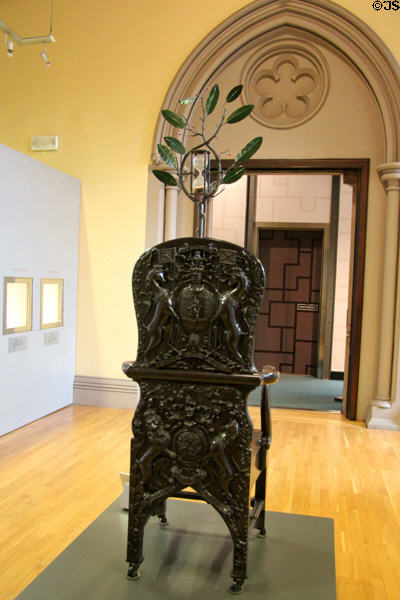 Rear of Blackstone chair which incorporates hourglass to time oral exams up to mid 19th C at Hunterian Museum. Glasgow, Scotland.