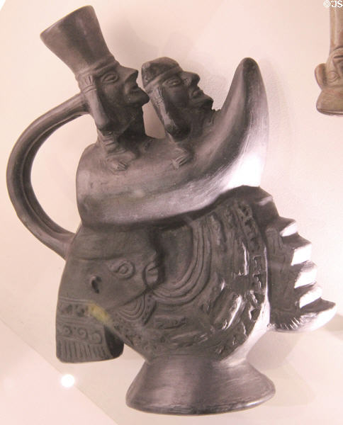 Chimu culture blackware earthenware vessel with fishermen in boat over Mamacocha (mother goddess) (c1050-1470) from North Coast Peru at Hunterian Museum. Glasgow, Scotland.