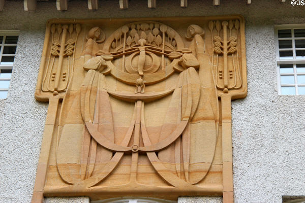Tree of Life sandstone carving over music room terrace as interpreted by stone mason Jack Kennedy from C.R. Mackintosh's three cm high sketch at House for an Art Lover. Glasgow, Scotland.