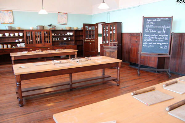 Work tables and cupboards in cookery kitchen at Scotland Street School Museum. Glasgow, Scotland.