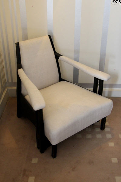 Upholstered easy chair (1905) by C.R. Mackintosh in drawing room at Hill House. Helensburgh, Scotland.