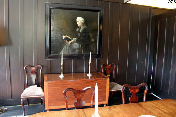 Portrait over chest & side chairs in dining room at Hill House. Helensburgh, Scotland.