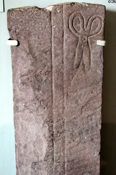 Base for cross carved (1200s) with scissors or shears at Dumbarton Castle. Glasgow, Scotland.