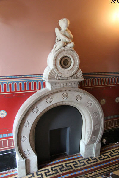 Entrance hall horseshoe arch fireplace at Holmwood. Glasgow, Scotland.