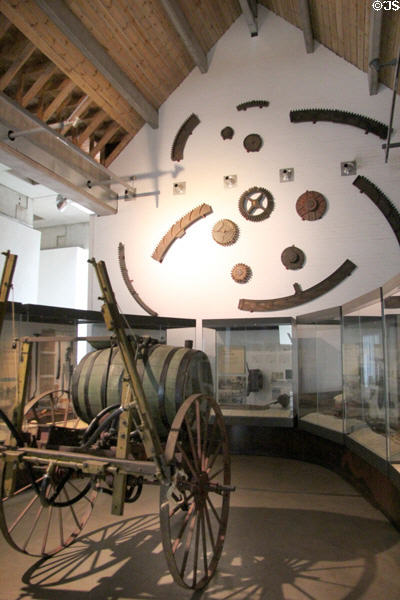 Gallery with water barrel on iron wheeled cart at National Museum of Rural Life. Kittochside, Scotland.