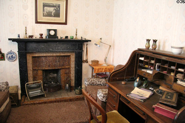 Parlor with black stone fireplace & roil-top desk (1907) in Reid farmhouse at National Museum of Rural Life. Kittochside, Scotland.