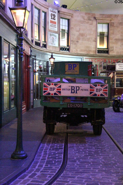 British Petrol flatbed delivery lorry (1919-20) by Caledon Motors Ltd. of Glasgow on replica historical streetscape at Riverside Museum. Glasgow, Scotland.