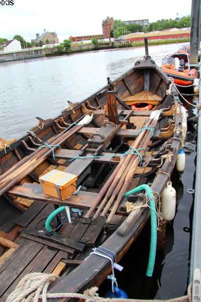 Heritage wooden row boat docked at Kelvin Harbour. Glasgow, Scotland.
