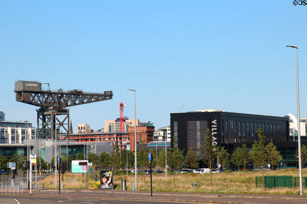 Clydeport Finnieston crane, brick Tower of the Winds (1894) & Village building. Glasgow, Scotland.