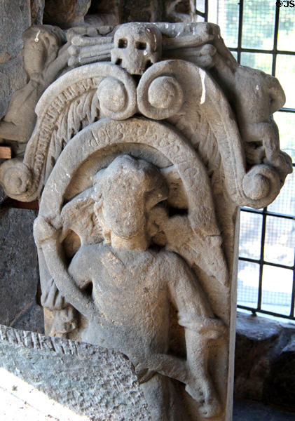Stone carving of figure under skull & crossbones at Dunfermline Palace. Dunfermline, Scotland.
