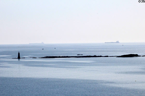 Distant shipping & lighthouse seen from Tantallon Castle. Scotland.