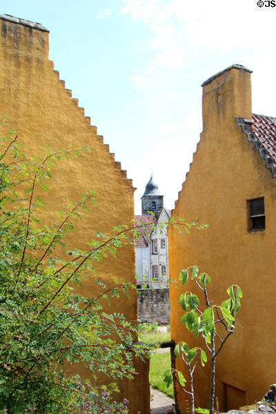 Glimpse of town between buildings of Culross Palace. Culross, Scotland.