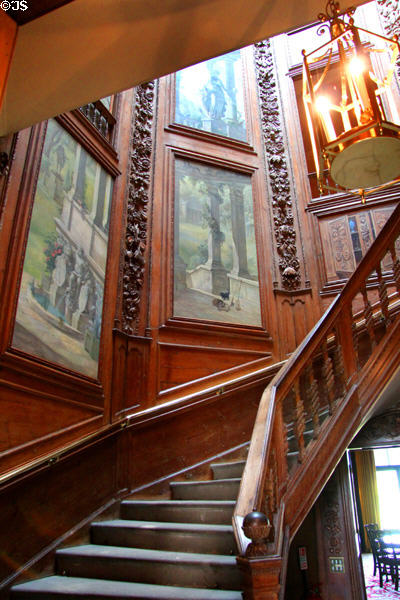 Octagonal oak staircase (early 1700s) by William Bruce with carved, pine paneled walls containing murals at Hopetoun House. Queensferry, Scotland.