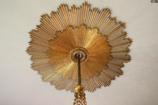 Ceiling roundel in sunburst pattern over chandelier in State Dining Room at Hopetoun House. Queensferry, Scotland.