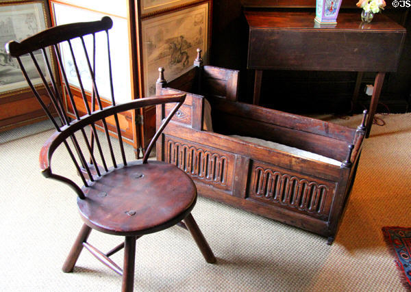 Wooden spindle chair & cradle in West Wainscot Bedchamber at Hopetoun House. Queensferry, Scotland.