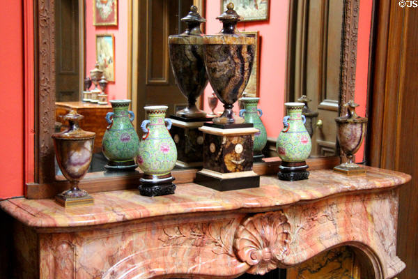 Collection of stone vases & urns on carved mantle in Reception Hall at Lauriston Castle at Lauriston Castle. Edinburgh, Scotland.