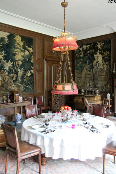 Two level electric metal chandelier with fringed shades in dining room at Lauriston Castle. Edinburgh, Scotland.