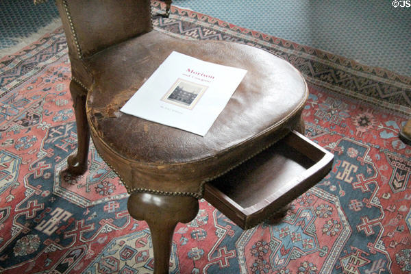 Paper drawer in seat of reversible reading chair in library at Lauriston Castle. Edinburgh, Scotland.