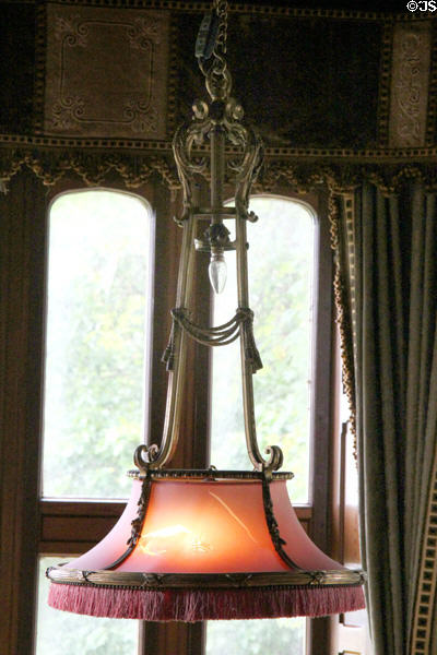 Hanging lamp with fringed shade in library alcove at Lauriston Castle. Edinburgh, Scotland.