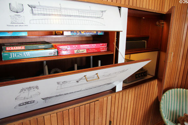 Cabinets with games in Sun lounge on Royal Yacht Britannia. Edinburgh, Scotland.