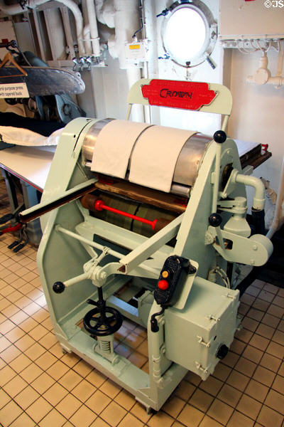 Ironer in laundry on Royal Yacht Britannia. Edinburgh, Scotland.