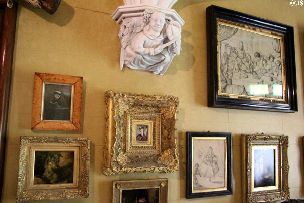 Paintings surround corbel with musical angel in ante-room at Abbotsford House. Melrose, Scotland.