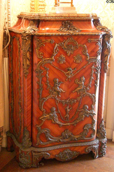 Cabinet with baroque putti playing in drawing room at Manderston House. Duns, Scotland.