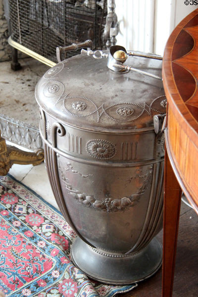 Metal coal bucket beside morning room fireplace at Manderston House. Duns, Scotland.