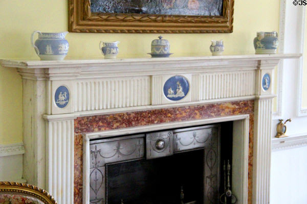 Fireplace with white & blue bisque inserts in portico bedroom at Manderston House. Duns, Scotland.