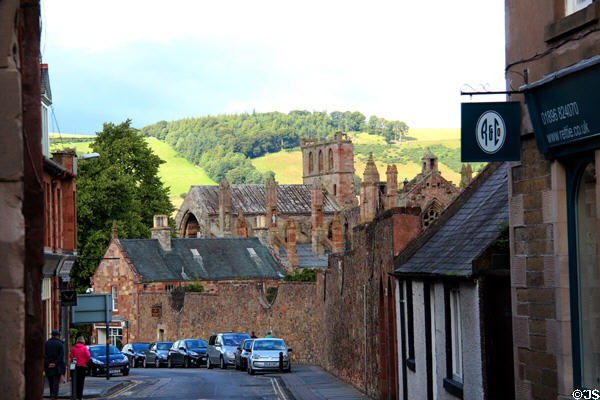 Melrose Abbey ruins rise above Melrose town. Melrose, Scotland.