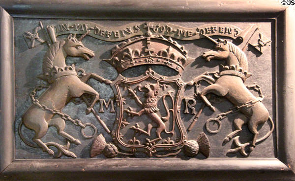 Carved plaque with Scottish royal arms with unicorns initialed MR at Traquair House. Scotland.