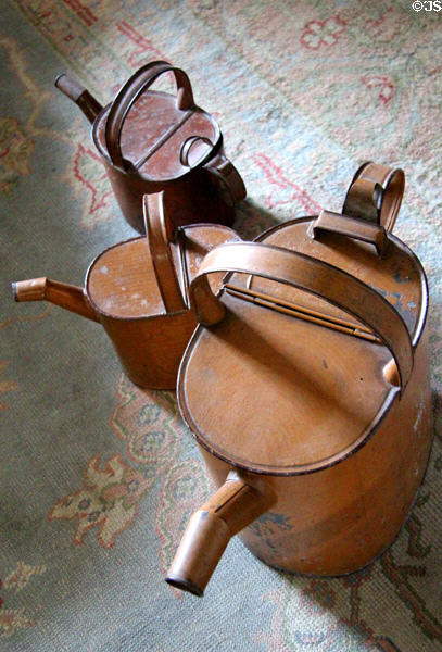Tin watering cans to carry bathwater to bathtub in dressing room at Traquair House. Scotland.