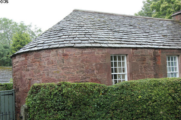 Rounded end of stone cottages at base of St Vigeans Church. Arbroath, Scotland.