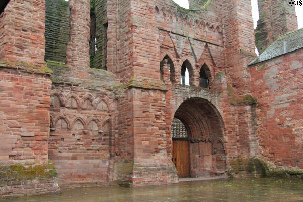 Entrance arch in ruins Arbroath Abbey run as a museum by Historic Scotland (HES). Arbroath, Scotland.