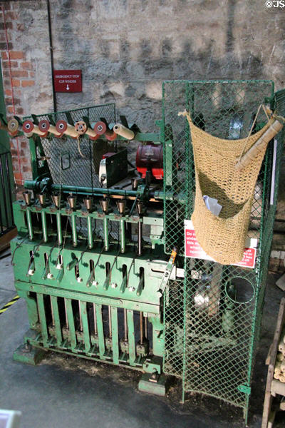 Jute cop winding machine to move thread to shuttle bobbins for weaving looms at Verdant Works Museum. Dundee, Scotland.