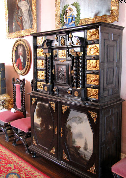 Carved & painted chest with carved woman holding thistle in great hall at Glamis Castle. Angus, Scotland.