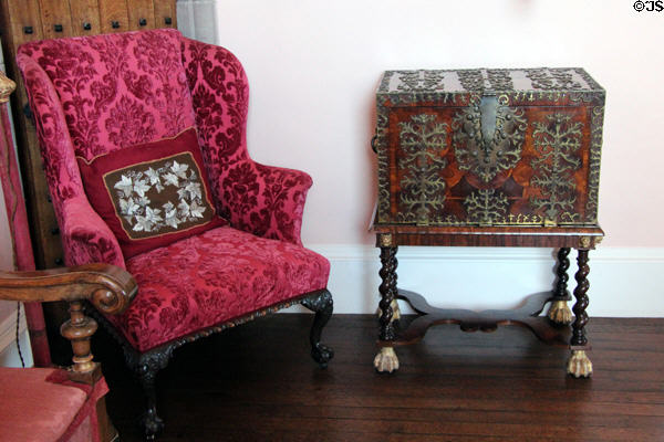 Armchair & metal bound chest in great hall at Glamis Castle. Angus, Scotland.