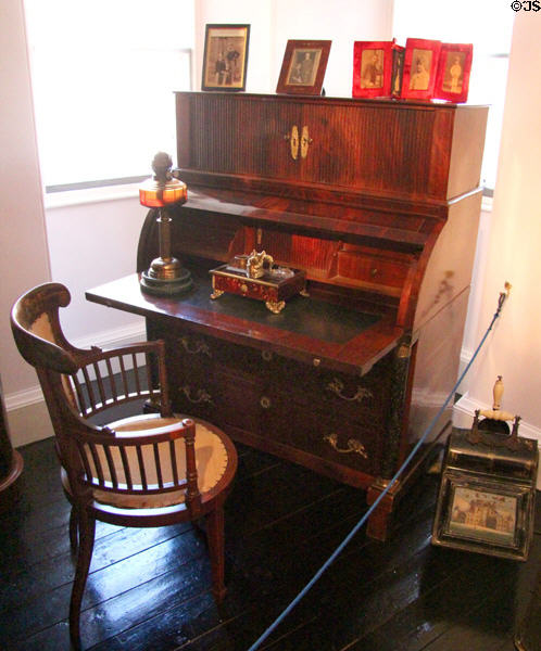 Drop front desk owned by King George VI with round armchair in king's bedroom at Glamis Castle. Angus, Scotland.