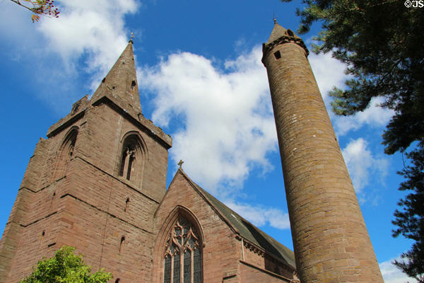 Medieval Irish-type round tower (11thC) beside later Brechin Cathedral. Brechin, Scotland.