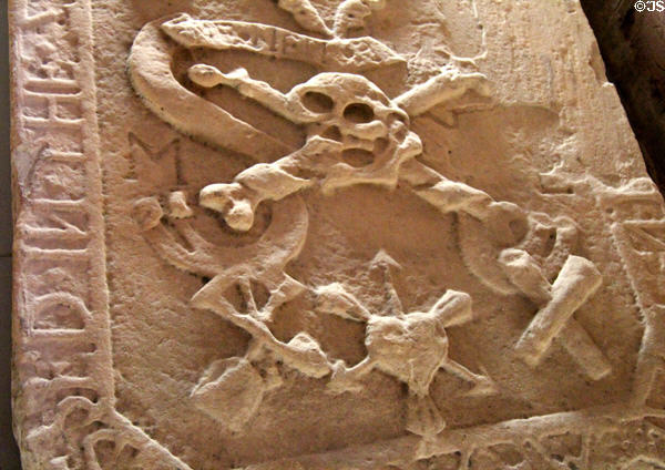 Skull & crossbones tombstone (1639) in museum at St Andrews Cathedral. St Andrews, Scotland.