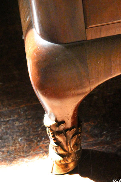 Robert Lorimer's signature design of feet on his bookshelf cabinet at Kellie Castle. Pittenweem, Scotland.