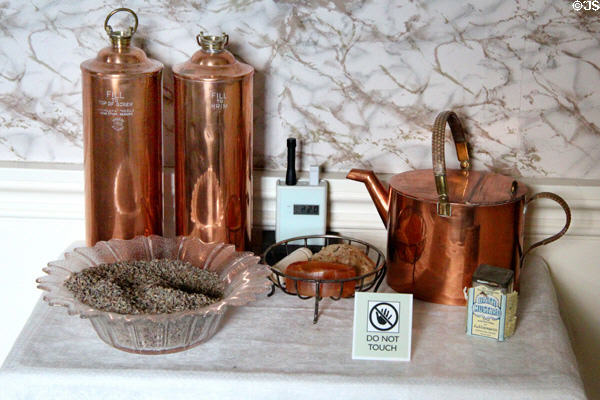 Copper Shirleys Hecla style hot water bottles bed warmer with filling canister at Hill of Tarvit Mansion. Cupar, Scotland.