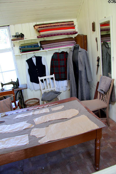 Cutting table in D MacPherson Tailor & Outfitter shop at Highland Folk Museum. Newtonmore, Scotland.