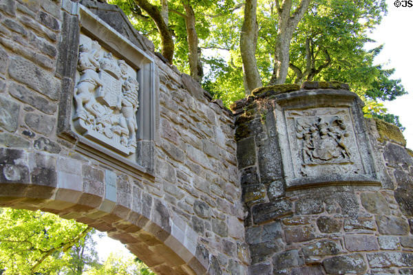 Arched gate from Old Palace (c1580-1600) with semi-circular towers bearing arms of King James & Lord Stormont at Scone Palace. Perth, Scotland.