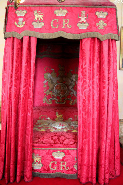 Bed canopy with royal crests in Ambassador's room at Scone Palace. Perth, Scotland.