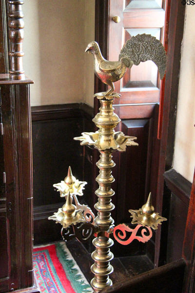Metal candle stick topped with rooster at Broughton House. Kirkcudbright, Scotland.