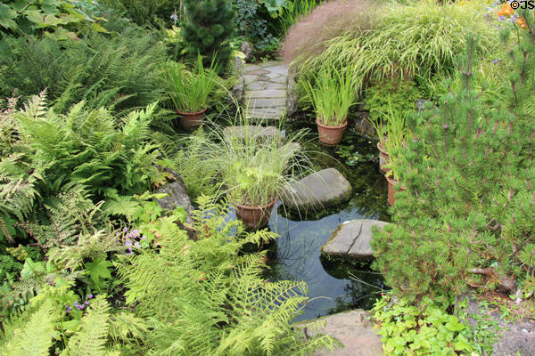 Pond with stepping stones in garden at Broughton House. Kirkcudbright, Scotland.