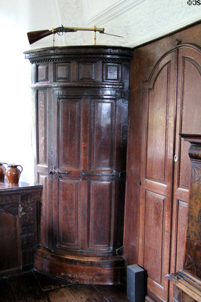 Corner door to hidden spiral staircase in The Hall at Craigievar Castle. Alford, Scotland.